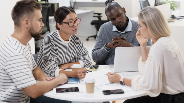 close-up-young-colleagues-having-meeting
